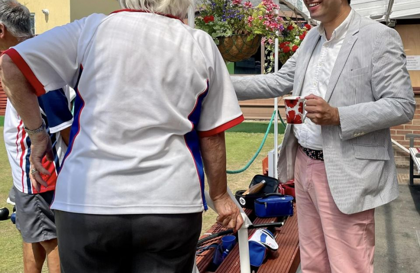 Ranil enjoying a cup of tea and a conversation with one of the players