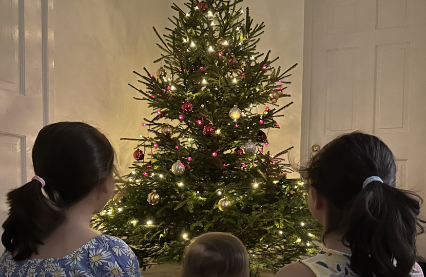 Family by the Christmas tree