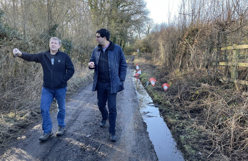 Ranil talking to a local resident on a road