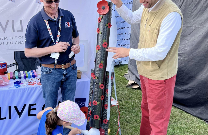 Ranil and his daughter playing one of the stalls