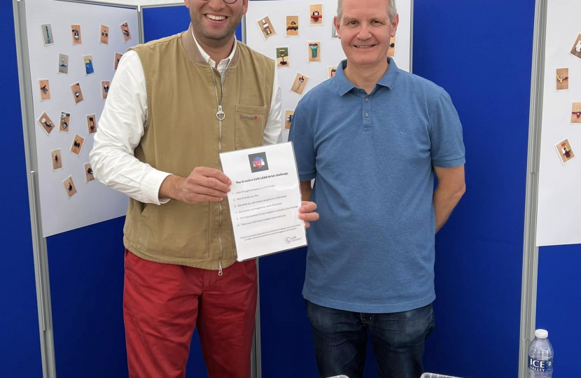 Ranil at the lego stall with the person running it