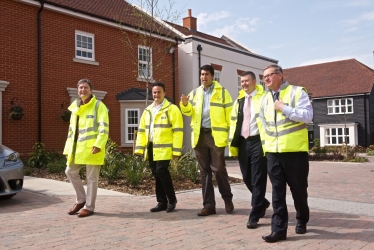 Ranil Jayawardena MP (centre), visiting new Brownfield Housing in Odiham