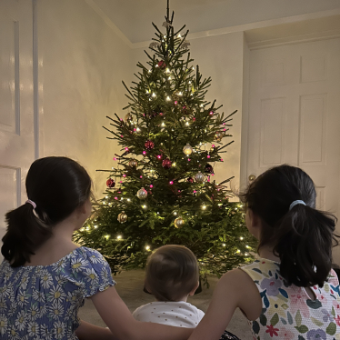 Family by the Christmas tree