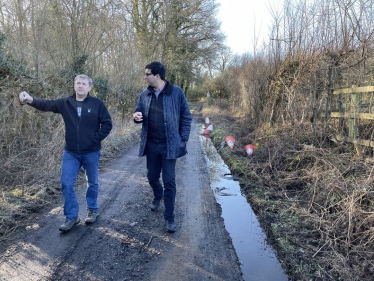 Ranil talking to a local resident on a road